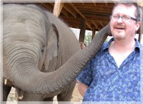 man with elephant on counseling retreat holiday